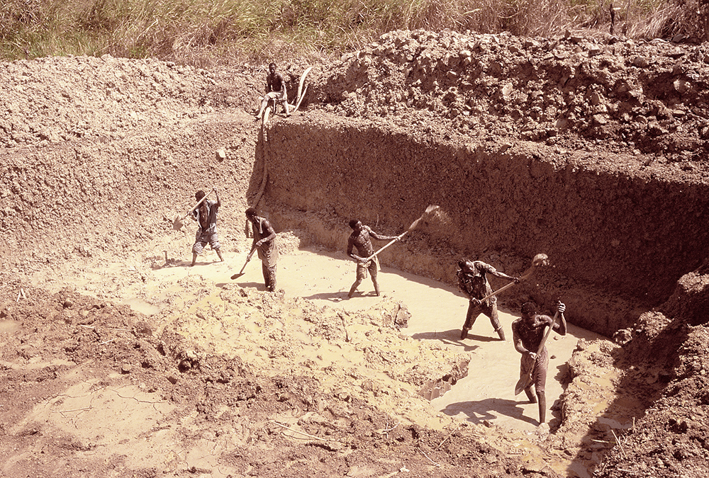 Hand laborers opening a new pit
